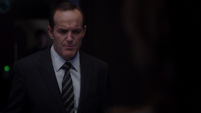 A ghost looms over coulson's shoulder.